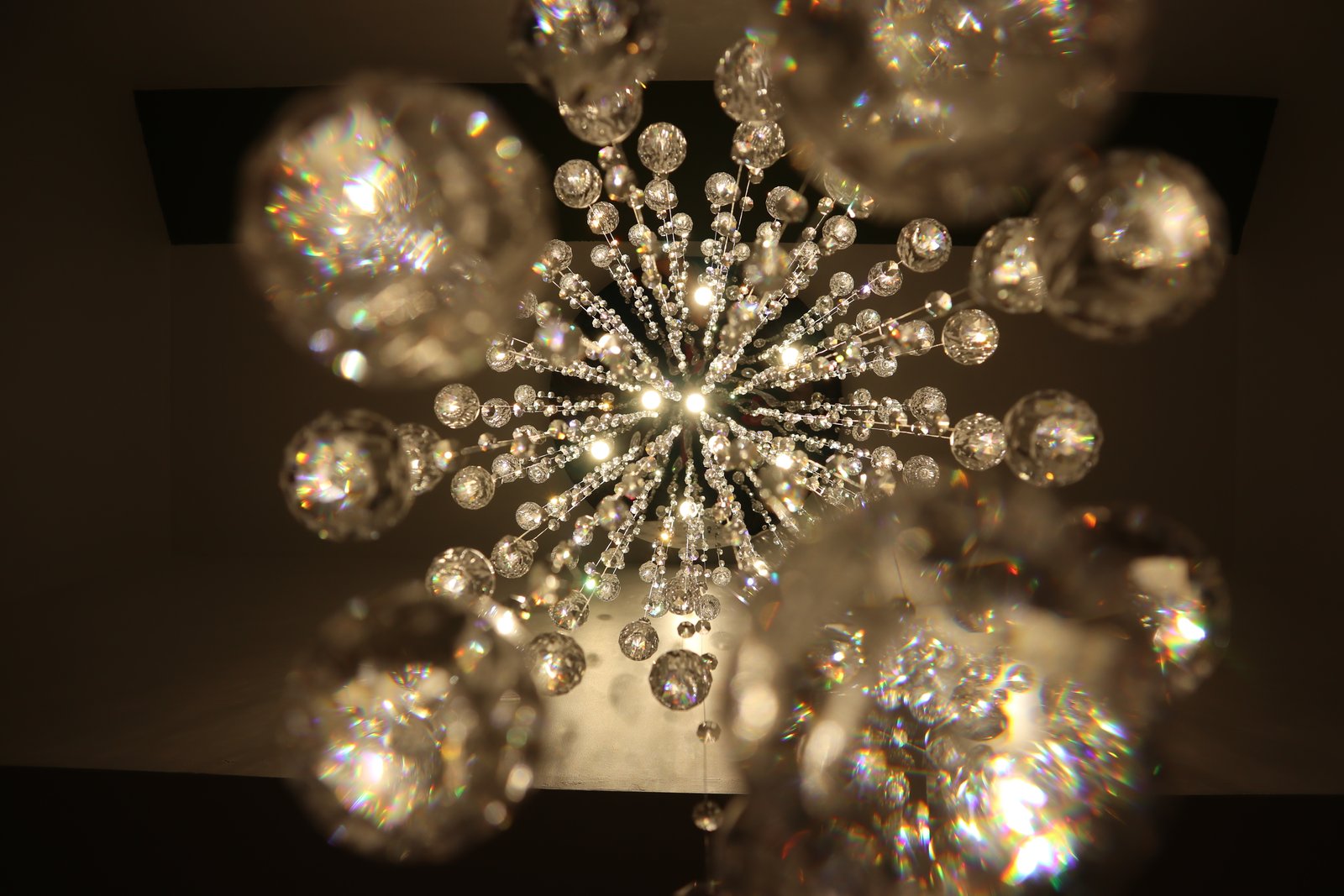 Looking straight up into a chandelier